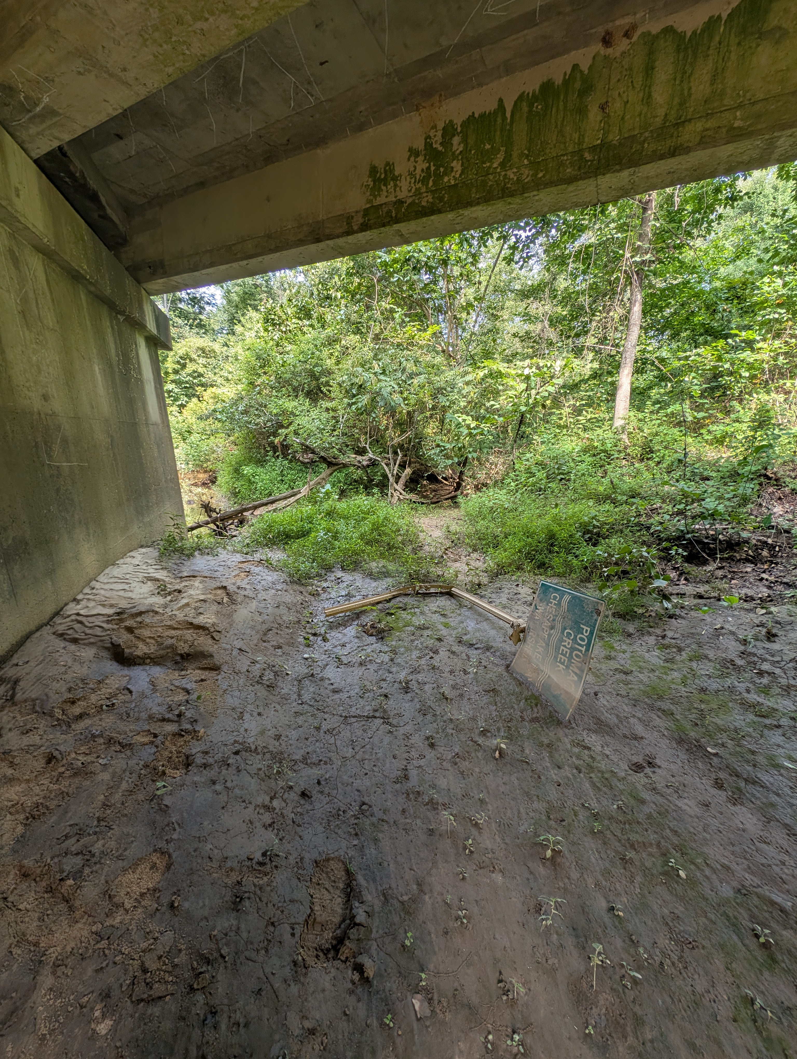 The abandoned and neglected Potomac Creek Watershed sign that appears to have eroded and washed out and been forgotten.